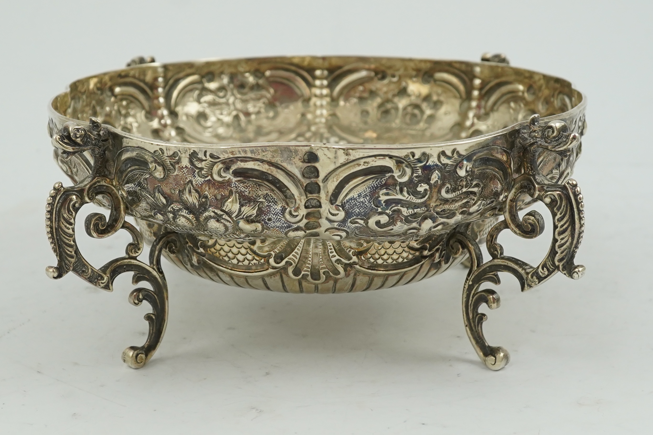 A late Victorian embossed lobed silver bowl, by Goldsmiths & Silversmiths Co Ltd?